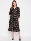 Front neck and waist tucks with baloon sleeve printed dress in Black