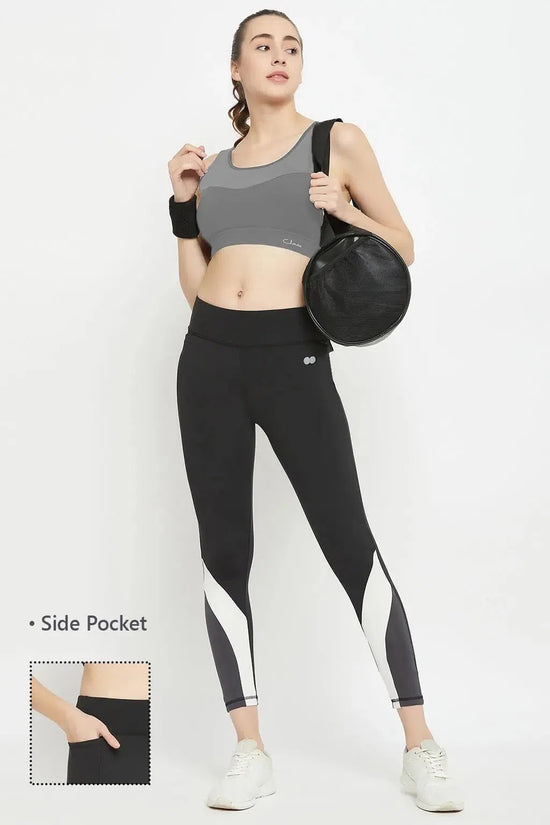 Clovia High Rise Active Tights in Black with Contrast Panels & Side Pocket