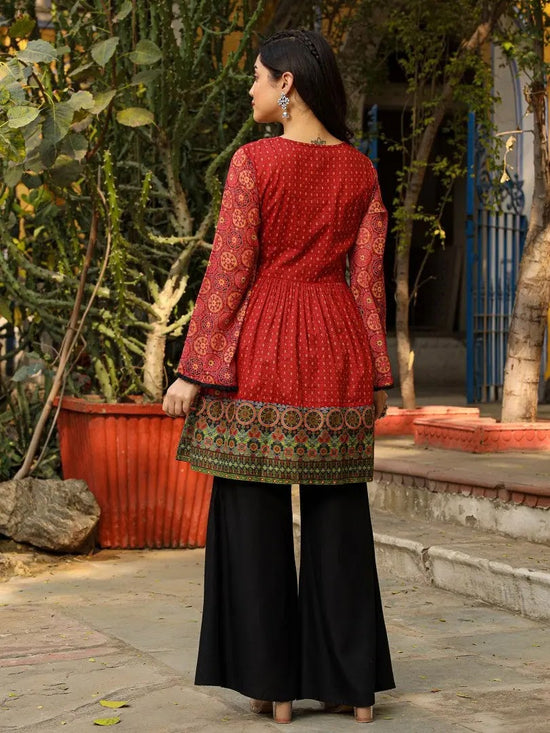 Rust Ethnic Motif Printed Cotton & Chiffon Peplum Tunic With Thread Embroidery & Tassels