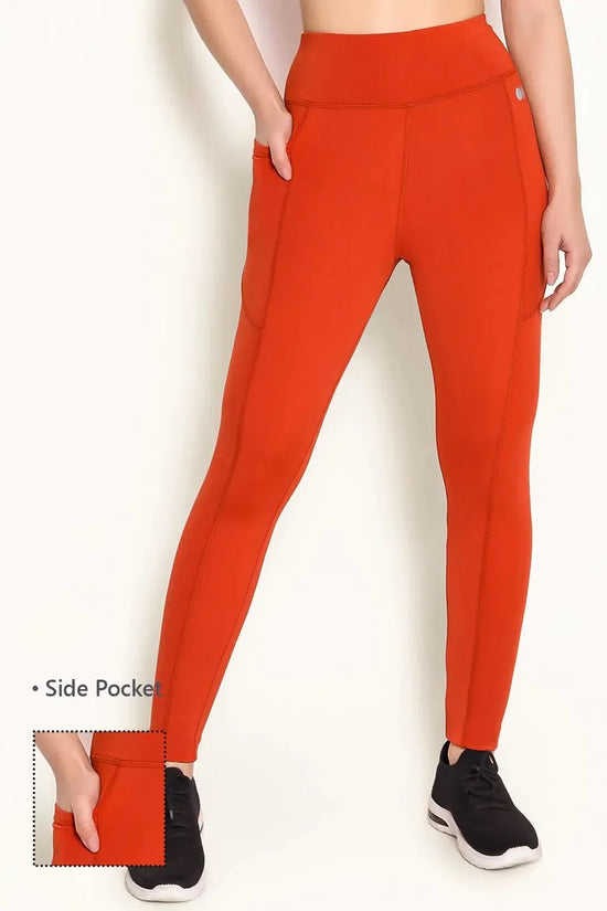 Clovia High-Rise Active Tights in Orange with Side Pocket