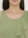 Peplum top with asymmetric ruffle and printed hem in Pista Green