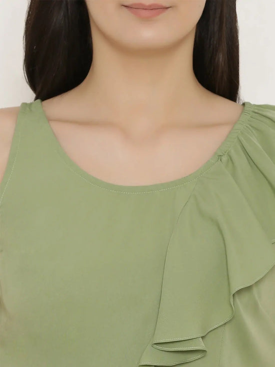 Peplum top with asymmetric ruffle and printed hem in Pista Green