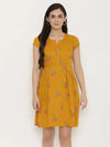 Short Block printed dress with front placket and side gathers in Mustard