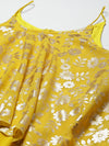 Asymmetric drape jumpsuit in Yellow