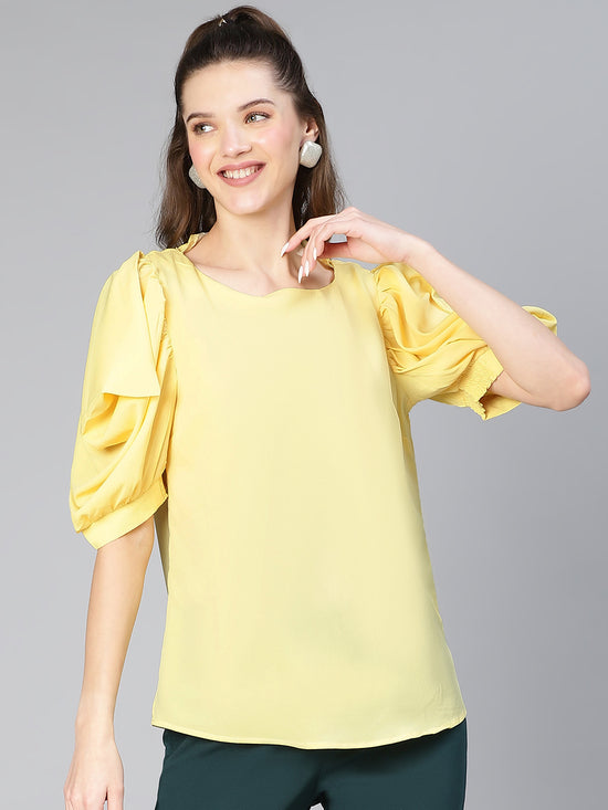 Women solid yellow puff sleeve polyester top